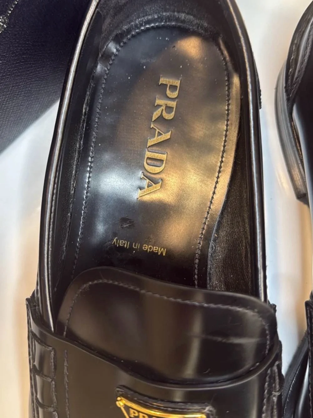 Prada Black Leather Men's Slip-On Loafers with Gold Logo